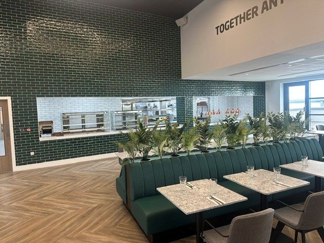 Restaurant seating in front of the servery at the AFCB Performance Centre
