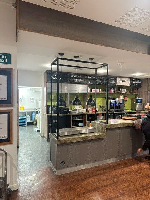 Lit display gantry in the student canteen at Winchester School of Art