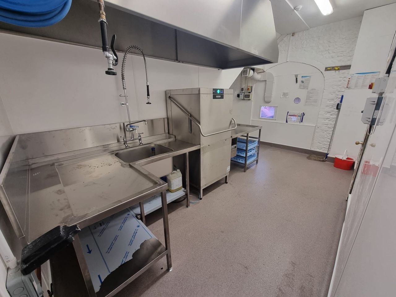 Pre-rinse sink and spray next to the dishwasher at West Dean College